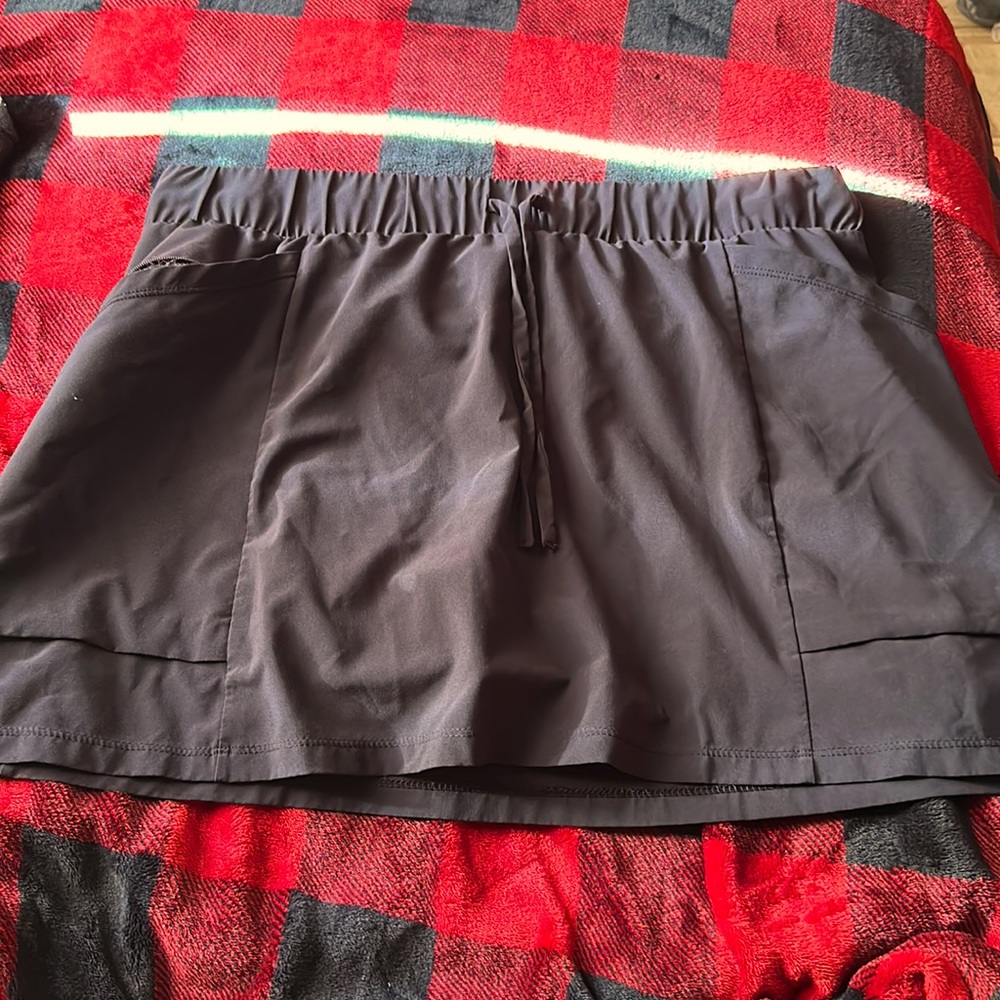 Never worn shirt skirt with built in shorts underneath